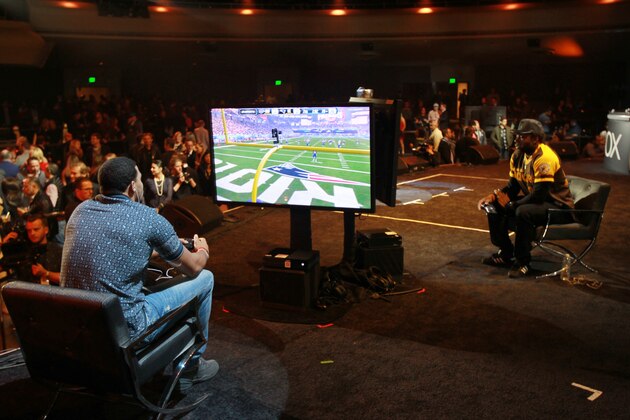 Washington Redskins tight end Jordan Reed and Kansas City Chiefs safety Eric Berry compete in the finals of EA SPORTS Madden Bowl XXII, Thursday, Feb. 4, 2016, in San Francisco.  (Donald Traill/AP Images for EA SPORTS)