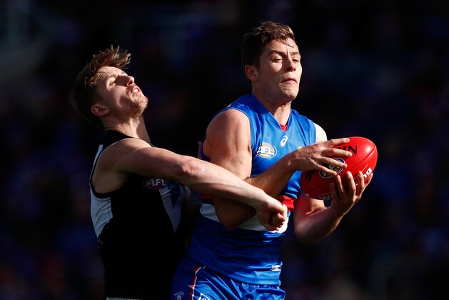 BALLARAT, AUSTRALIA - AUGUST 19: Josh Dunkley of the Bulldogs and Hamish Hartlett of the Power compete for the ball during the 2017 AFL round 22 match between the Western Bulldogs and the Port Adelaide Power at Mars Stadium on August 19, 2017 in Ballarat, Australia. (Photo by Adam Trafford/AFL Media/Getty Images)