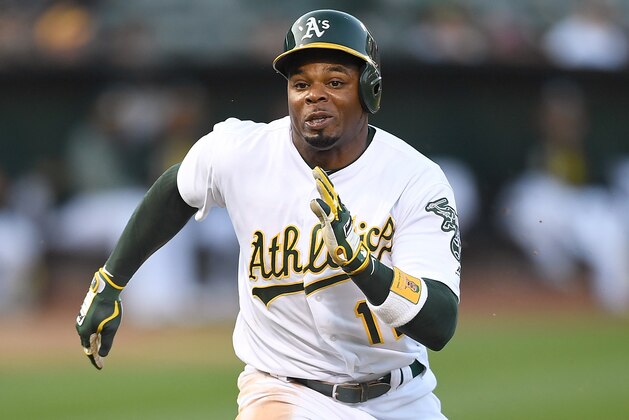 OAKLAND, CA - AUGUST 10:  Rajai Davis #11 of the Oakland Athletics scores on a sacrifice fly from Jed Lowrie #8 against the Baltimore Orioles in the bottom of the first inning at Oakland Alameda Coliseum on August 10, 2017 in Oakland, California.  (Photo by Thearon W. Henderson/Getty Images)