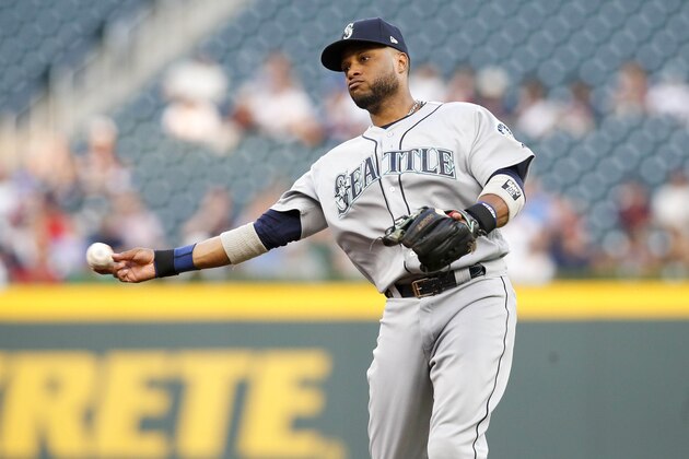 Aug 22, 2017; Atlanta, GA, USA; Seattle Mariners second baseman Robinson Cano (22) throws a runner out at first against the Atlanta Braves in the first inning at SunTrust Park. Mandatory Credit: Brett Davis-USA TODAY Sports