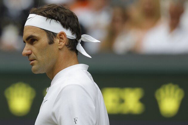 Switzerland's Roger Federer pauses as he plays Croatia's Marin Cilic in the Men's Singles final match on day thirteen at the Wimbledon Tennis Championships in London Sunday, July 16, 2017. (AP Photo/Alastair Grant)