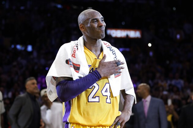 Los Angeles Lakers' Kobe Bryant pounds his chest after the last NBA basketball game of his career, against the Utah Jazz, Wednesday, April 13, 2016, in Los Angeles. (AP Photo/Jae C. Hong)