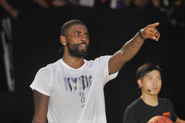NBA Cleveland Cavaliers guard Kyrie Irving gives instructions while he holds a short basketball clinic with young Taiwanese players in Taipei, Taiwan, Saturday, July 22, 2017.(AP Photo/Chiang Ying-ying)
