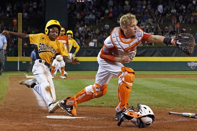 Lufkin, Texas, catcher Chandler Spencer, right, can't handle the throw from first baseman Mark Requena, allowing Greenville, N.C.'s Cash Daniels-Moye to score the winning run on a ball hit by Thomas Barrett during the seventh inning of a baseball game at the Little League World Series in South Williamsport, Pa., Wednesday, Aug. 23, 2017. North Carolina won 2-1. (AP Photo/Gene J. Puskar) Lufkin, Texas, catcher Chandler Spencer, right, can't handle the throw from first baseman Mark Requena, allowing Greenville, N.C.'s Cash Daniels-Moye to score the winning run on a ball hit by Thomas Barrett during the seventh inning of a baseball game at the Little League World Series in South Williamsport, Pa., Wednesday, Aug. 23, 2017. North Carolina won 2-1. (AP Photo/Gene J. Puskar)
