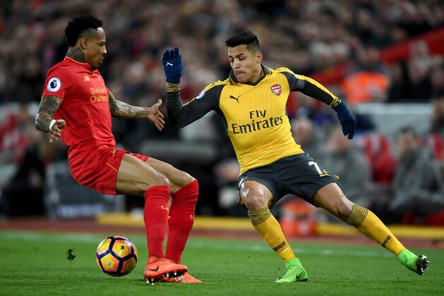 LIVERPOOL, ENGLAND - MARCH 04:  Alexis Sanchez of Arsenal (R) attempts to take it past Nathaniel Clyne of Liverpool (L) during the Premier League match between Liverpool and Arsenal at Anfield on March 4, 2017 in Liverpool, England.  (Photo by Laurence Griffiths/Getty Images)