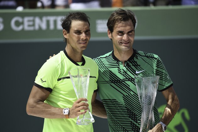 KEY BISCAYNE, FL - APRIL 02:  Winner Roger Federer of Switzerland and runner-up Rafael Nadal of Spain hold their trophies after the Men's Final at Crandon Park Tennis Center on April 2, 2017 in Key Biscayne, Florida  (Photo by Ron Elkman/Sports Imagery/Getty Images)