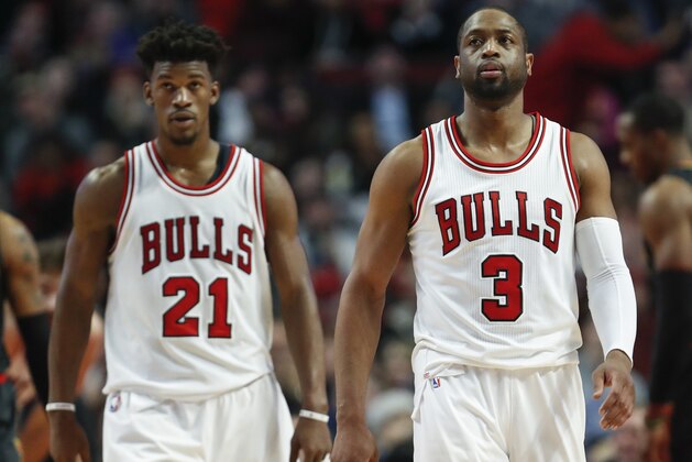 Chicago Bulls guard Dwyane Wade (3) and forward Jimmy Butler (21) walk on the court during the second half of an NBA basketball game against the Atlanta Hawks, Wednesday, Jan. 25, 2017, in Chicago. The Hawks won 119-114. (AP Photo/Kamil Krzaczynski)