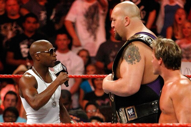 LAS VEGAS - AUGUST 24:  (L-R) Boxer Floyd Mayweather Jr. appears in the ring with wrestlers Big Show and Chris Jericho during the WWE Monday Night Raw show at the Thomas & Mack Center August 24, 2009 in Las Vegas, Nevada. Mayweather was a special guest host during the broadcast.  (Photo by Ethan Miller/Getty Images)
