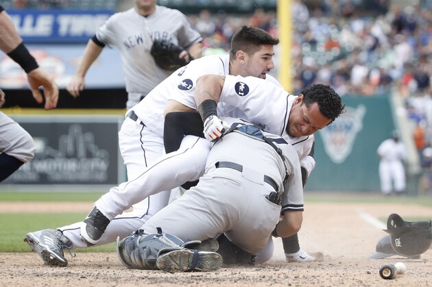 DETROIT, MI - AUGUST 24: Miguel Cabrera #24 of the Detroit Tigers fights with Austin Romine #27 of the New York Yankees after words were exchanged during a game at Comerica Park on August 24, 2017 in Detroit, Michigan. (Photo by Joe Robbins/Getty Images)