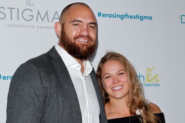 BEVERLY HILLS, CA - APRIL 28:  (L-R) Travis Browne and Ronda Rousey attend the 20th anniversary of 'Erasing The Stigma Leadership Awards' at The Beverly Hilton Hotel on April 28, 2016 in Beverly Hills, California.  (Photo by Tibrina Hobson/Getty Images)