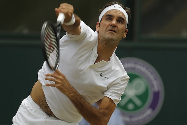 File-This July 16, 2017, file photo shows Switzerland's Roger Federer serving to Croatia's Marin Cilic in the Men's Singles final match at the Wimbledon Tennis Championships in London. (AP Photo/Alastair Grant, File) File-This July 16, 2017, file photo shows Switzerland's Roger Federer serving to Croatia's Marin Cilic in the Men's Singles final match at the Wimbledon Tennis Championships in London. (AP Photo/Alastair Grant, File)