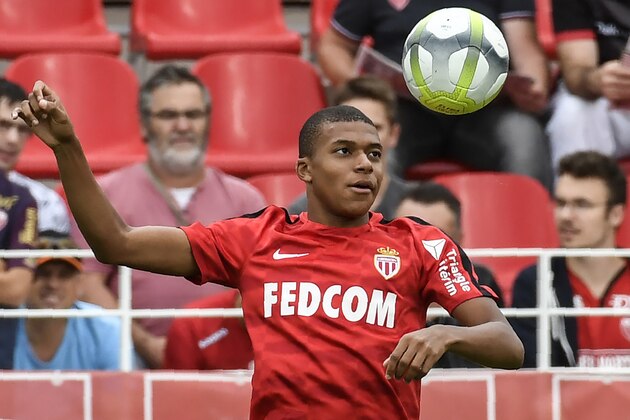 Monaco's French forward Kylian Mbappe warms up before the French Ligue 1 football match between Dijon FCO and AS Monaco, on August 13, 2017 at Gaston Gerard stadium in Dijon, northern France. / AFP PHOTO / PHILIPPE DESMAZES        (Photo credit should read PHILIPPE DESMAZES/AFP/Getty Images)