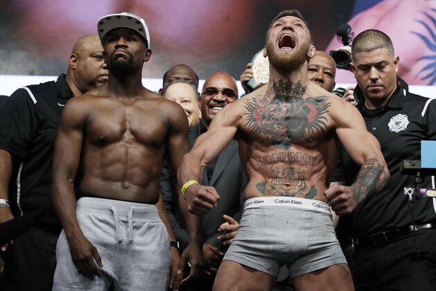 Floyd Mayweather Jr., left, and Conor McGregor pose during weight-ins Friday, Aug. 25, 2017, in Las Vegas for their boxing bout scheduled for Saturday. (AP Photo/John Locher) Floyd Mayweather Jr., left, and Conor McGregor pose during weight-ins Friday, Aug. 25, 2017, in Las Vegas for their boxing bout scheduled for Saturday. (AP Photo/John Locher)