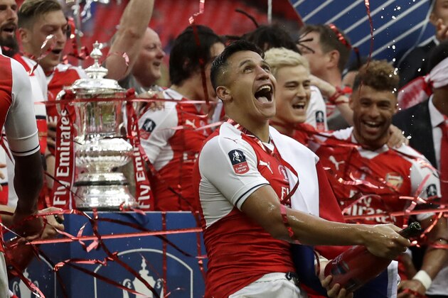 Arsenal's Alexis Sanchez celebrates winning the English FA Cup final soccer match between Arsenal and Chelsea at the Wembley stadium in London, Saturday, May 27, 2017. (AP Photo/Matt Dunham)