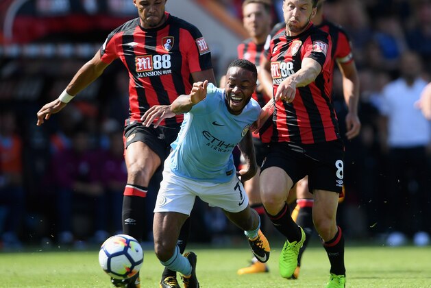 BOURNEMOUTH, ENGLAND - AUGUST 26:  Tyrone Mings of AFC Bournemouth and Harry Arter of AFC Bournemouth foul Raheem Sterling of Manchester City during the Premier League match between AFC Bournemouth and Manchester City at Vitality Stadium on August 26, 2017 in Bournemouth, England.  (Photo by Mike Hewitt/Getty Images)