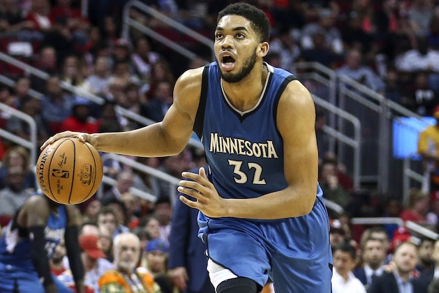 Apr 12, 2017; Houston, TX, USA; Minnesota Timberwolves center Karl-Anthony Towns (32) dribbles the ball during the third quarter against the Houston Rockets at Toyota Center. Mandatory Credit: Troy Taormina-USA TODAY Sports