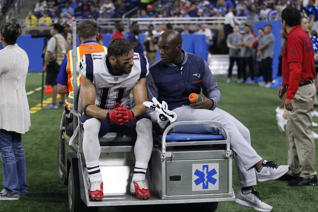 New England Patriots wide receiver Julian Edelman (11) is taken off the field on a cart during the first half of an NFL preseason football game against the Detroit Lions, Friday, Aug. 25, 2017, in Detroit. (AP Photo/Duane Burleson)