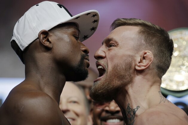 Floyd Mayweather Jr., left, and Conor McGregor face off during a weigh-in Friday, Aug. 25, 2017, in Las Vegas. The two are scheduled to fight in a boxing match Saturday in Las Vegas. (AP Photo/John Locher) Floyd Mayweather Jr., left, and Conor McGregor face off during a weigh-in Friday, Aug. 25, 2017, in Las Vegas. The two are scheduled to fight in a boxing match Saturday in Las Vegas. (AP Photo/John Locher)
