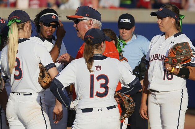 Auburn coach Clint Myers talks with his team in the pitching circle in the second inning of the second game of the best-of-three championship series against Oklahoma in the NCAA Women's College World Series in Oklahoma City, Tuesday, June 7, 2016. (AP Photo/Sue Ogrocki)