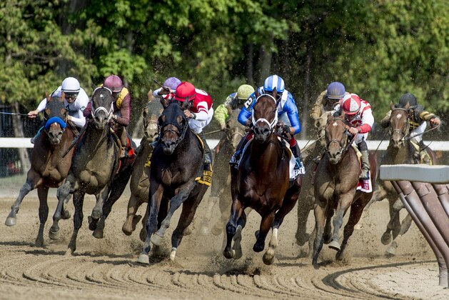 SARATOGA SPRINGS, NY - AUGUST 26: Practical Joke (red cap, inside) #1, with Joel Rosario comes up the rail on the turn for home en route to winning the H. Allen Jerkens Stakes on Travers Stakes Day at Saratoga Race Course on August 26, 2017 in Saratoga Springs, New York. (Photo by Bob Mayberger/Eclipse Sportswire/Getty Images)