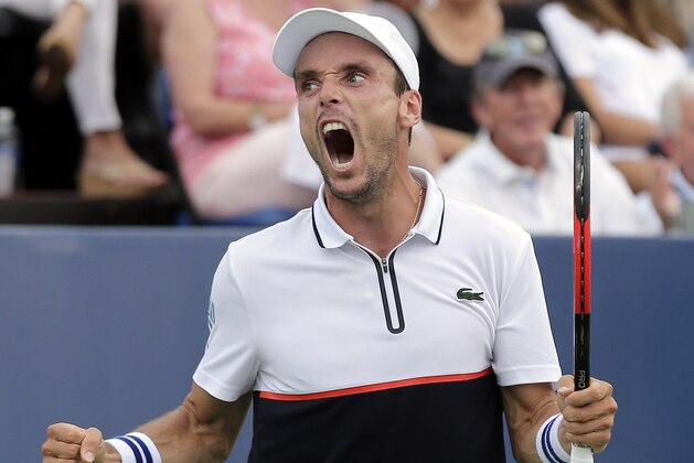 Roberto Bautista Agut, of Spain, reacts after defeating Damir Dzumhur, of Bosnia-Herzegovina, to win the Winston-Salem Open tennis tournament in Winston-Salem, N.C., Saturday, Aug. 26, 2017. (AP Photo/Chuck Burton)