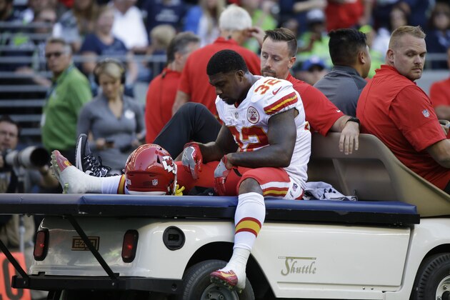 Kansas City Chiefs Spencer Ware leaves the field on a cart after being injured against the Seattle Seahawks in the first half of an NFL football preseason game, Friday, Aug. 25, 2017, in Seattle. (AP Photo/Elaine Thompson)