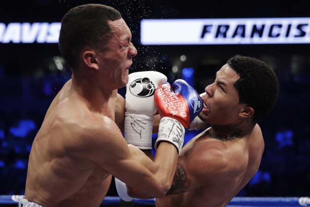 Gervonta Davis, right, hits Francisco Fonseca, of Costa Rica, in a boxing match Saturday, Aug. 26, 2017, in Las Vegas. (AP Photo/Isaac Brekken)