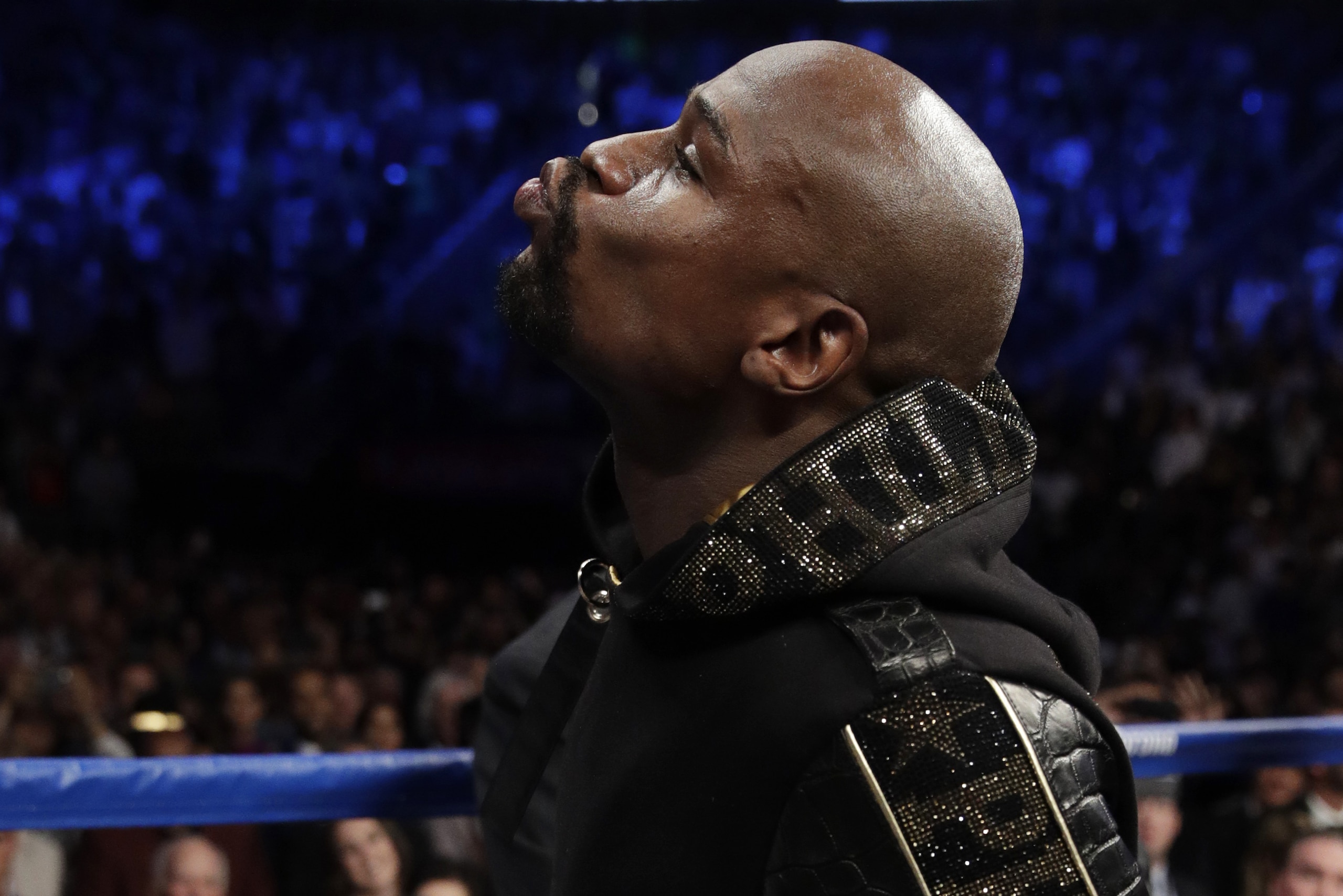 Floyd Mayweather Jr. enters the ring before a super welterweight boxing match against Conor McGregor, Saturday, Aug. 26, 2017, in Las Vegas. (AP Photo/Isaac Brekken)