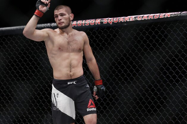 Nov 12, 2016; New York, NY, USA; Khabib Nurmagomedov (red gloves) defeats Michael Johnson (blue gloves) during UFC 205 at Madison Square Garden. Mandatory Credit: Adam Hunger-USA TODAY Sports