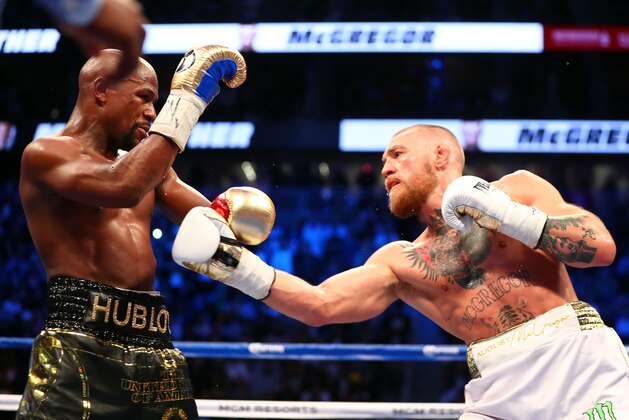 Aug 26, 2017; Las Vegas, NV, USA; Conor McGregor moves in with a hit against Floyd Mayweather Jr. during the sixth round at T-Mobile Arena. Mandatory Credit: Mark J. Rebilas-USA TODAY Sports Aug 26, 2017; Las Vegas, NV, USA; Conor McGregor moves in with a hit against Floyd Mayweather Jr. during the sixth round at T-Mobile Arena. Mandatory Credit: Mark J. Rebilas-USA TODAY Sports