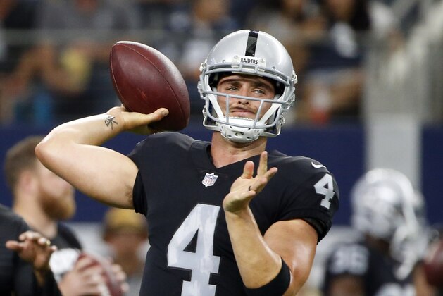 Oakland Raiders quarterback Derek Carr (4) throws a pass during warm ups before a preseason NFL football game against the Dallas Cowboys on Saturday, Aug. 26, 2017, in Arlington, Texas. (AP Photo/Michael Ainsworth)