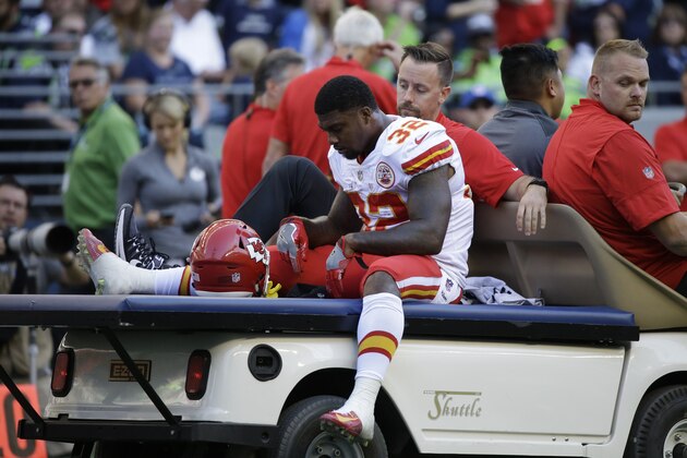 Kansas City Chiefs Spencer Ware leaves the field on a cart after being injured against the Seattle Seahawks in the first half of an NFL football preseason game, Friday, Aug. 25, 2017, in Seattle. (AP Photo/Elaine Thompson)