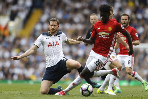 Tottenham's Jan Vertonghen, left, competes for the ball with Manchester United's Axel Tuanzebe during the English Premier League soccer match between Tottenham Hotspur and Manchester United at White Hart Lane stadium in London, Sunday, May 14, 2017. (AP Photo/Frank Augstein)