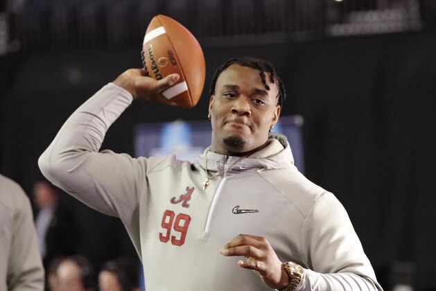 Alabama's Raekwon Davis throws a ball during media day for the NCAA college football playoff championship game against Clemson Saturday, Jan. 7, 2017, in Tampa, Fla. (AP Photo/David J. Phillip)