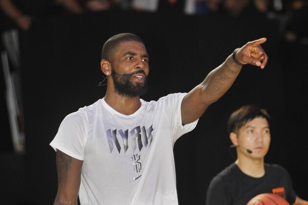 NBA Cleveland Cavaliers guard Kyrie Irving gives instructions while he holds a short basketball clinic with young Taiwanese players in Taipei, Taiwan, Saturday, July 22, 2017.(AP Photo/Chiang Ying-ying)