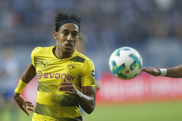 Dortmund's Gabonese forward Pierre-Emerick Aubameyang eyes the ball during the German First division Bundesliga football match between Borussia Dortmund and Hertha Berlin in Dortmund, western Germany, on August 26, 2017. / AFP PHOTO / INA FASSBENDER / RESTRICTIONS: DURING MATCH TIME: DFL RULES TO LIMIT THE ONLINE USAGE TO 15 PICTURES PER MATCH AND FORBID IMAGE SEQUENCES TO SIMULATE VIDEO. == RESTRICTED TO EDITORIAL USE == FOR FURTHER QUERIES PLEASE CONTACT DFL DIRECTLY AT + 49 69 650050        (Photo credit should read INA FASSBENDER/AFP/Getty Images)