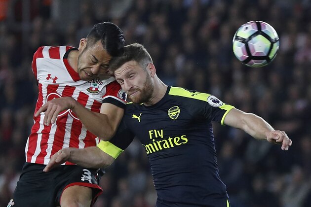 Southampton's Japanese defender Maya Yoshida (L) and Arsenal's German defender Shkodran Mustafi clash heads during the English Premier League football match between Southampton and Arsenal at St Mary's Stadium in Southampton, southern England on May 10, 2017. / AFP PHOTO / Adrian DENNIS / RESTRICTED TO EDITORIAL USE. No use with unauthorized audio, video, data, fixture lists, club/league logos or 'live' services. Online in-match use limited to 75 images, no video emulation. No use in betting, games or single club/league/player publications.  /         (Photo credit should read ADRIAN DENNIS/AFP/Getty Images)