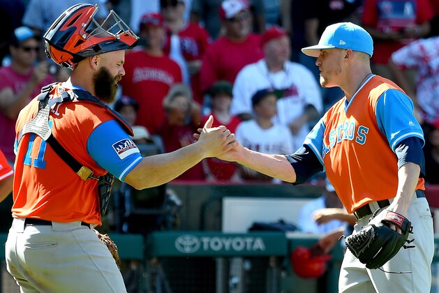 ANAHEIM, CA - AUGUST 27:  Ken Giles #53 shakes hands with catcher Evan Gattis #11 of the Houston Astros after earning a save in the ninth inning of the game against the Los Angeles Angels of Anaheim on August 27, 2017 in Anaheim, California.  (Photo by Jayne Kamin-Oncea/Getty Images)