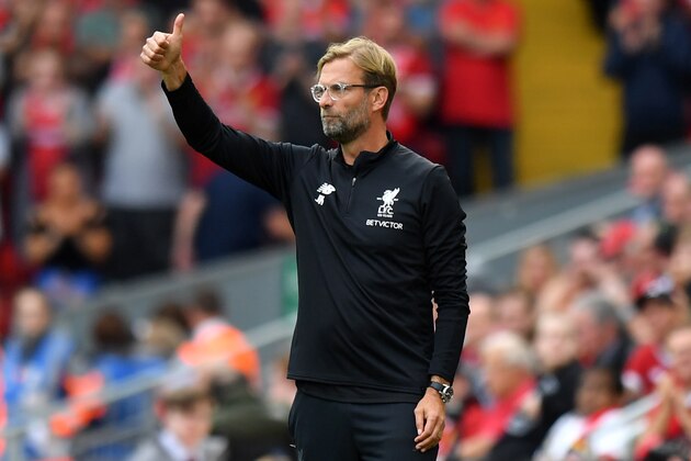 Liverpool's German manager Jurgen Klopp gestures on the touchline during the English Premier League football match between Liverpool and Arsenal at Anfield in Liverpool, north west England on August 27, 2017. / AFP PHOTO / Anthony Devlin / RESTRICTED TO EDITORIAL USE. No use with unauthorized audio, video, data, fixture lists, club/league logos or 'live' services. Online in-match use limited to 75 images, no video emulation. No use in betting, games or single club/league/player publications.  /         (Photo credit should read ANTHONY DEVLIN/AFP/Getty Images)