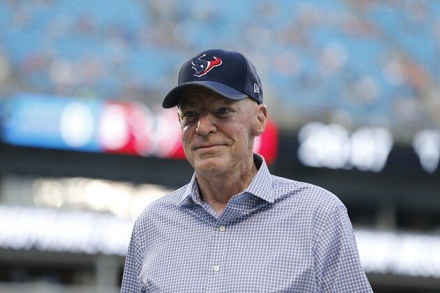Houston Texans owner Robert C. McNair walks on the field before the first half of an NFL preseason football game between the Carolina Panthers and the Houston Texans, Wednesday, Aug. 9, 2017, in Charlotte, N.C. (AP Photo/Jason E. Miczek)