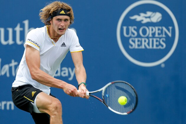 MASON, OH - AUGUST 16:  Alexander Zverev of Germany returns a shot to Frances Tiafoe of the United States during Day 5 of the Western and Southern Open at the Lindner Family Tennis Center on August 16, 2017 in Mason, Ohio.  (Photo by Michael Reaves/Getty Images)