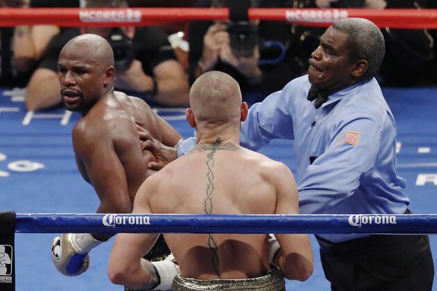 Referee Robert Byrd, right, stops the fight between Floyd Mayweather Jr., left, and Conor McGregor in a super welterweight boxing match Saturday, Aug. 26, 2017, in Las Vegas. (AP Photo/Eric Jamison) Referee Robert Byrd, right, stops the fight between Floyd Mayweather Jr., left, and Conor McGregor in a super welterweight boxing match Saturday, Aug. 26, 2017, in Las Vegas. (AP Photo/Eric Jamison)