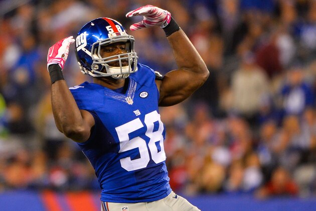 EAST RUTHERFORD, NJ - OCTOBER 11: Owamagbe Odighizuwa #58 of the New York Giants motions to the fans during a game against the San Francisco 49ers at MetLife Stadium on October 11, 2015 in East Rutherford, New Jersey.  (Photo by Alex Goodlett/Getty Images)