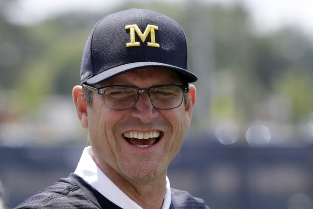 Michigan football coach Jim Harbaugh is seen, Monday, July 17, 2017, in Ann Arbor, Mich. (AP Photo/Carlos Osorio)