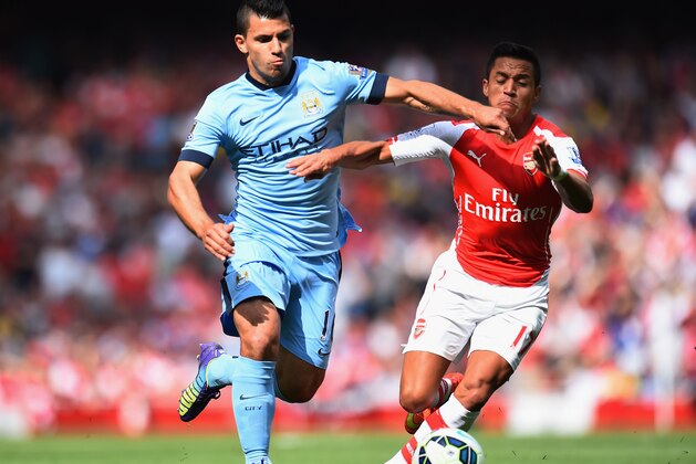 LONDON, ENGLAND - SEPTEMBER 13:  Sergio Aguero of Manchester City and Alexis Sanchez of Arsenal battle for the ball during the Barclays Premier League match between Arsenal and Manchester City at Emirates Stadium on September 13, 2014 in London, England.  (Photo by Shaun Botterill/Getty Images)