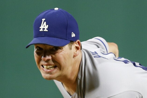 Los Angeles Dodgers starting pitcher Rich Hill throws a warmup pitch at the top of the seventh inning of a baseball game against the Pittsburgh Pirates, Wednesday, Aug. 23, 2017, in Pittsburgh. (AP Photo/Keith Srakocic)