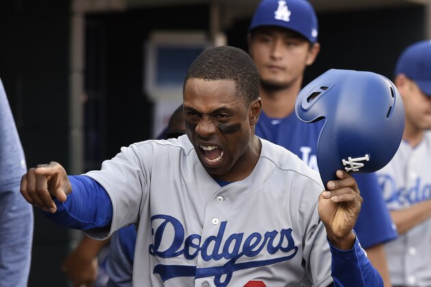 Los Angeles Dodgers outfielder Curtis Granderson celebrates in the dugout after scoring a run on an RBI single from teammate Adrian Gonzales in the seventh inning of a baseball game against the Detroit Tigers Saturday, Aug. 19, 2017, in Detroit. (AP Photo/Lon Horwedel)