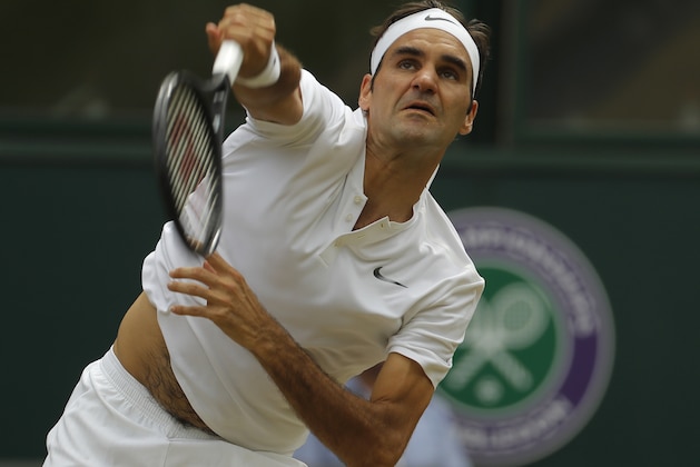 File-This July 16, 2017, file photo shows Switzerland's Roger Federer serving to Croatia's Marin Cilic in the Men's Singles final match at the Wimbledon Tennis Championships in London. (AP Photo/Alastair Grant, File)