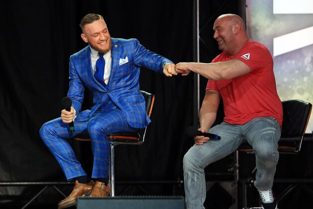 TORONTO, ON - JULY 12:   Conor McGregor shakes hands with UFC President Dana White during the Floyd Mayweather Jr. v Conor McGregor World Press Tour at Budweiser Stage on July 12, 2017 in Toronto, Canada.  (Photo by Vaughn Ridley/Getty Images)