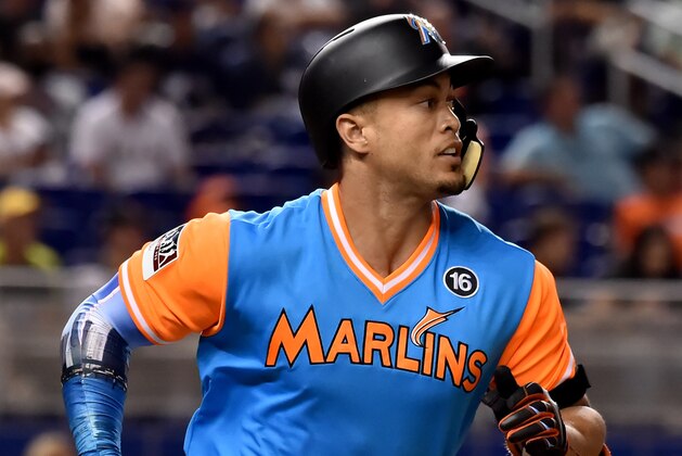 Aug 26, 2017; Miami, FL, USA; Miami Marlins right fielder Giancarlo Stanton (27) connects for a base hit in the third inning against the San Diego Padres at Marlins Park. Mandatory Credit: Steve Mitchell-USA TODAY Sports Aug 26, 2017; Miami, FL, USA; Miami Marlins right fielder Giancarlo Stanton (27) connects for a base hit in the third inning against the San Diego Padres at Marlins Park. Mandatory Credit: Steve Mitchell-USA TODAY Sports
